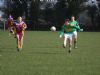 Mark Anthony pushes the ball in to the forward line