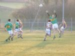 Sean cuts out a dangerous ball over the top