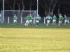 Oliver Duffin relieves the pressure by clearing out of defence