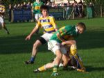 Odhran holds on to the ball under a challenge