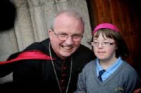 Donal McKeown pictured with Emma McDaid of St Annes Primary School, Derry.