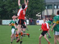 Paddy McAuley leaps and fields a high ball